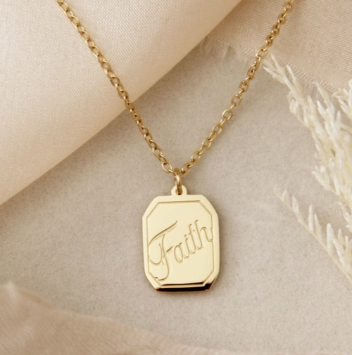 Gold necklace with 'Faith' pendant