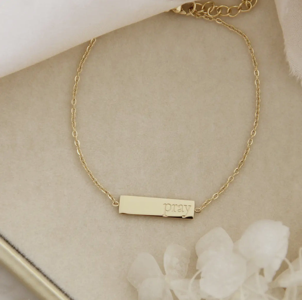 gold brecelet with pray